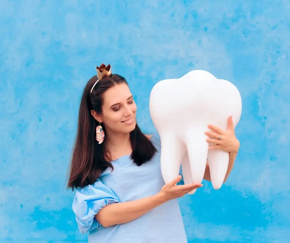 tooth fairy holding tooth